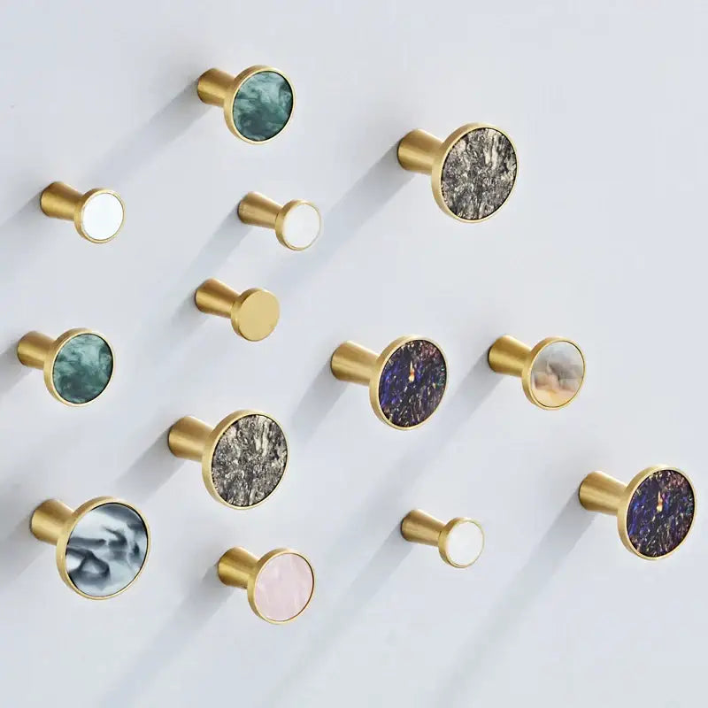 Modern marbled stone and decorbites brushed gold towel hook with circular marble inlays for bathroom decor