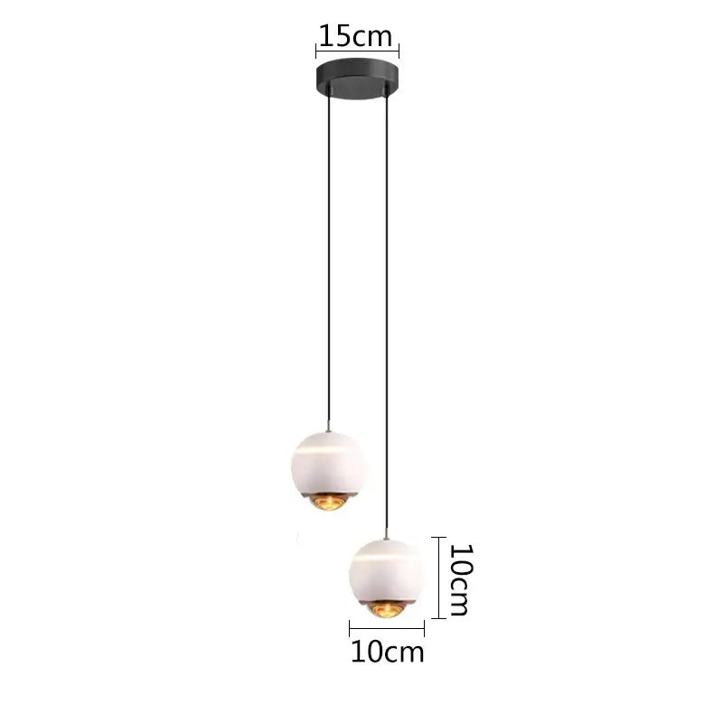 Modern matte ball pendant lights featuring two white glass spherical shades suspended by black cords for bedroom and kitchen