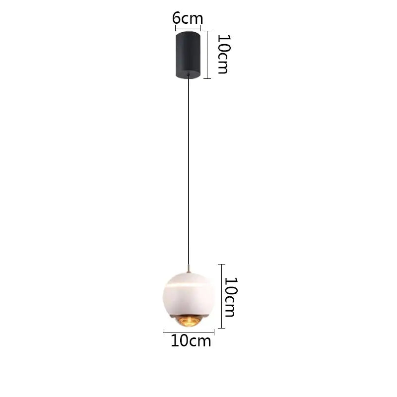 Minimalist matte white glass ball pendant light with black ceiling mount ideal for bedroom and kitchen island pendant lights