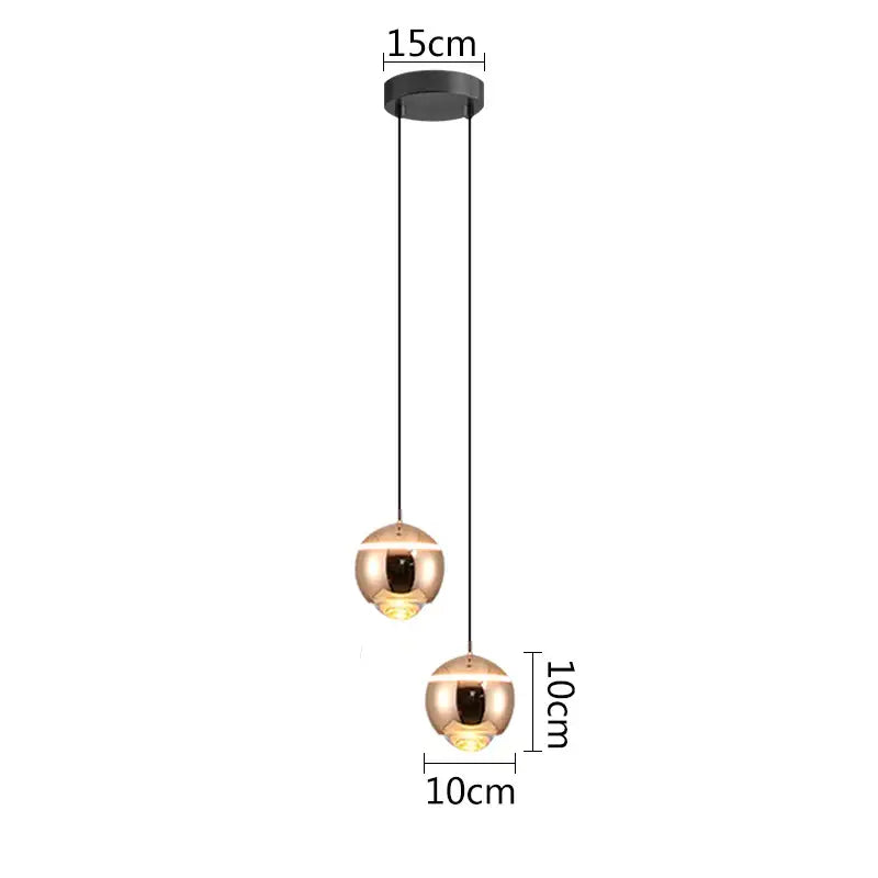 Modern matte copper-finished ball pendant lights with black cords for bedroom and kitchen island lighting