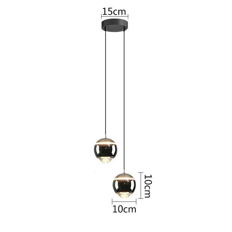 Modern matte black ball pendant lights with reflective glass finish and minimalist design for bedroom and kitchen island