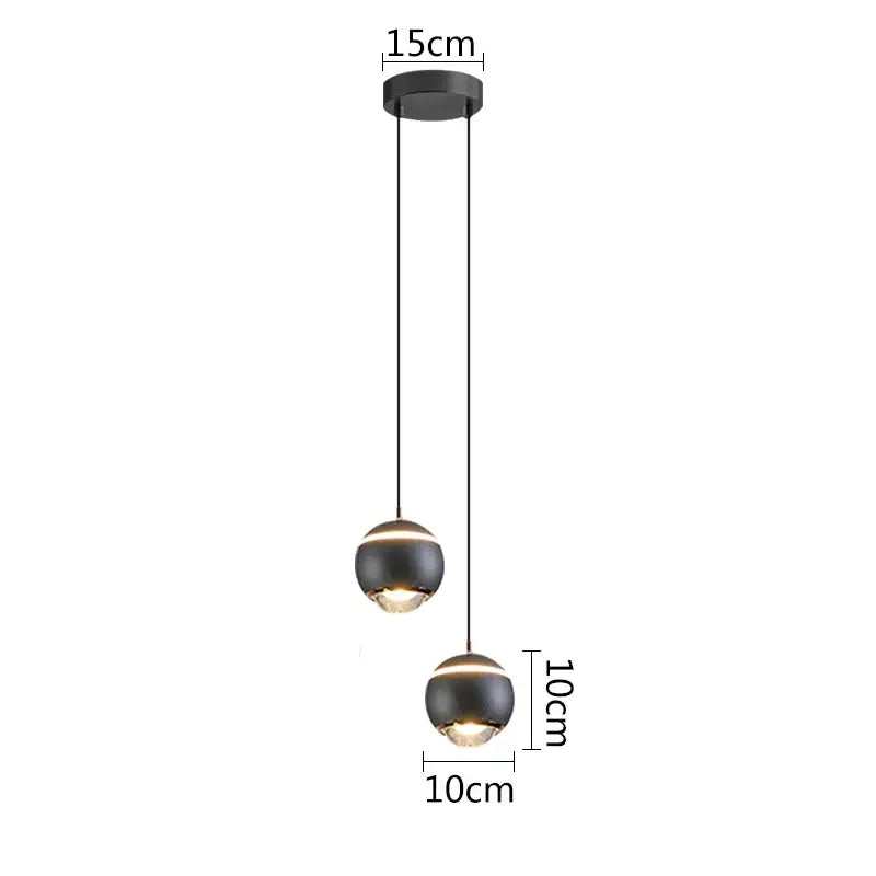 Modern matte black ball pendant lights with warm LED glow ideal for bedroom and kitchen island lighting