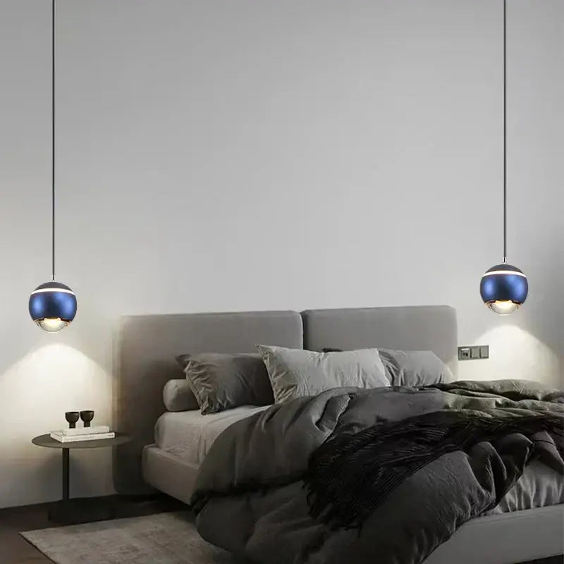 Modern matte blue ball pendant lights with metallic finish hanging from ceiling for bedroom and kitchen island