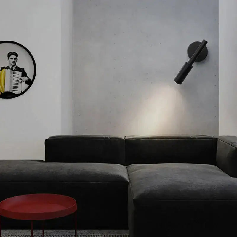 Modern matte black adjustable led wall lamp with a cylindrical matte finish ideal for bedroom reading light use