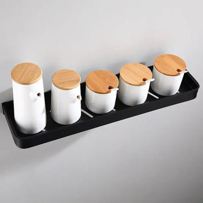 Modern matte black aluminum corner shelf with white ceramic spice jars and bamboo lids for black aluminum bathroom storage