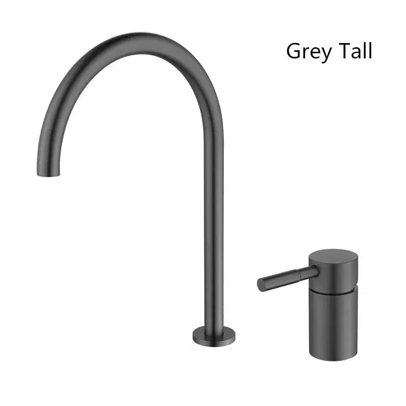 Modern matte black basin faucet with brushed gold accents featuring a grey tall curved spout and cylindrical handle