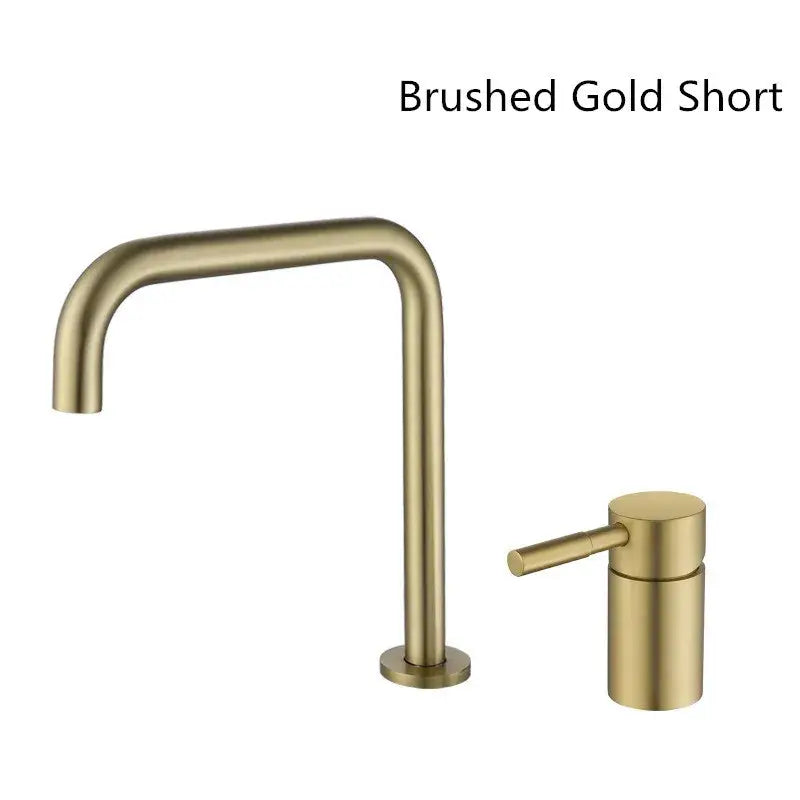 Modern matte black and brushed gold basin faucet with brushed gold short spout and sleek cylindrical handle for bathroom sink tap