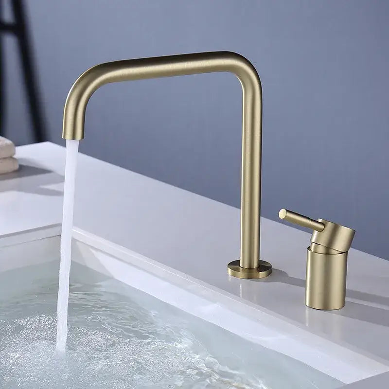 Modern matte black and brushed gold basin faucet with sleek curved spout and cylindrical handle for bathroom decorbites black basin