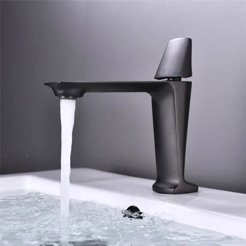 Modern matte black and white brass sink faucet with sleek angular design and tall spout for black brass bathroom decorbites