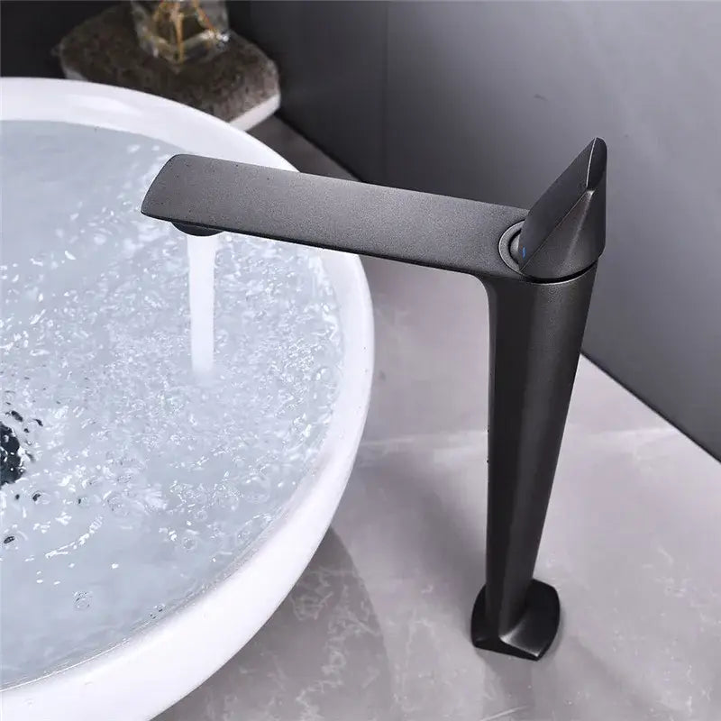 Modern matte black and white brass sink faucet with sleek angular design and tall spout for black brass bathroom decorbites