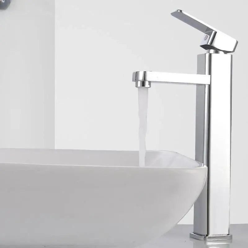 Modern chrome-finished tall basin faucet with sleek minimalist design complementing decorbites black basin faucet