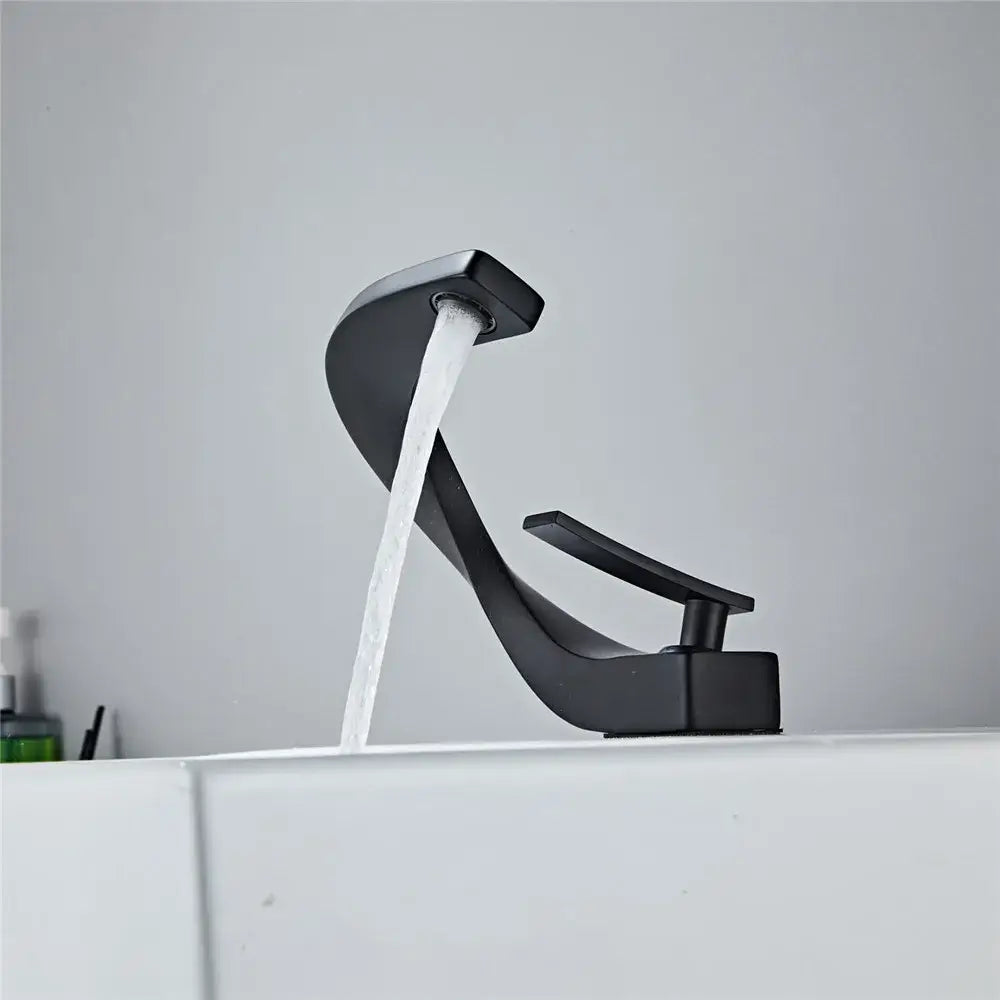 Modern matte black basin faucet with sleek curved design and single lever handle decorbites black basin faucet