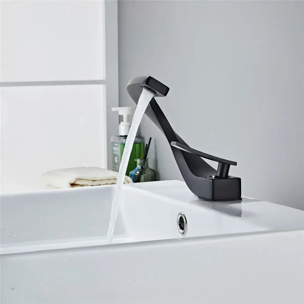 Modern matte black basin faucet with sleek angular design flowing water into white sink for bathroom use decorbites black basin faucet