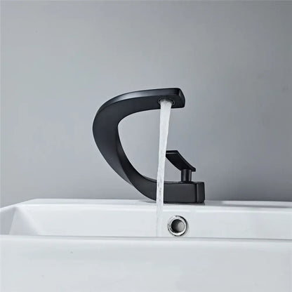 Modern matte black basin faucet with sleek curved design and black matte finish for bathroom hot cold mixing tap decorbites black basin
