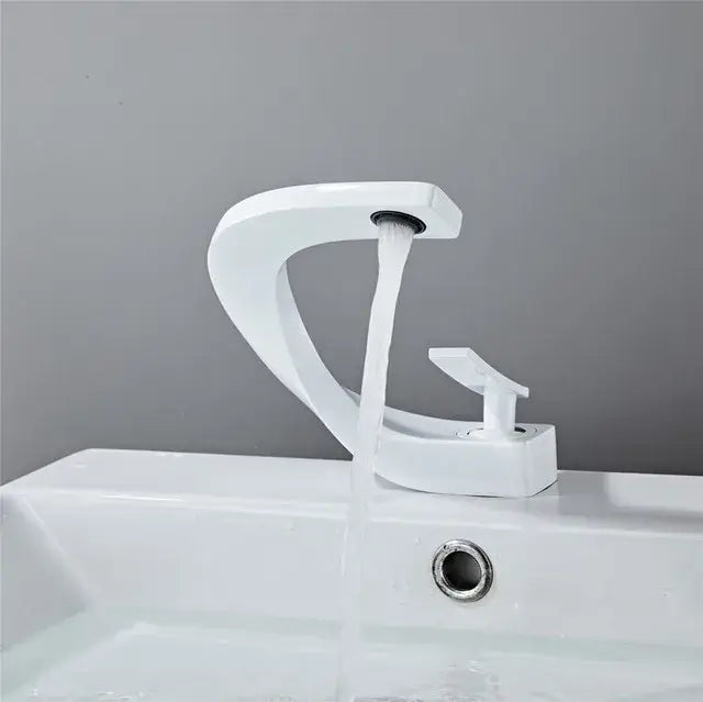 Modern white ceramic basin faucet with sleek curved design and minimalist handle for decorbites black basin faucet
