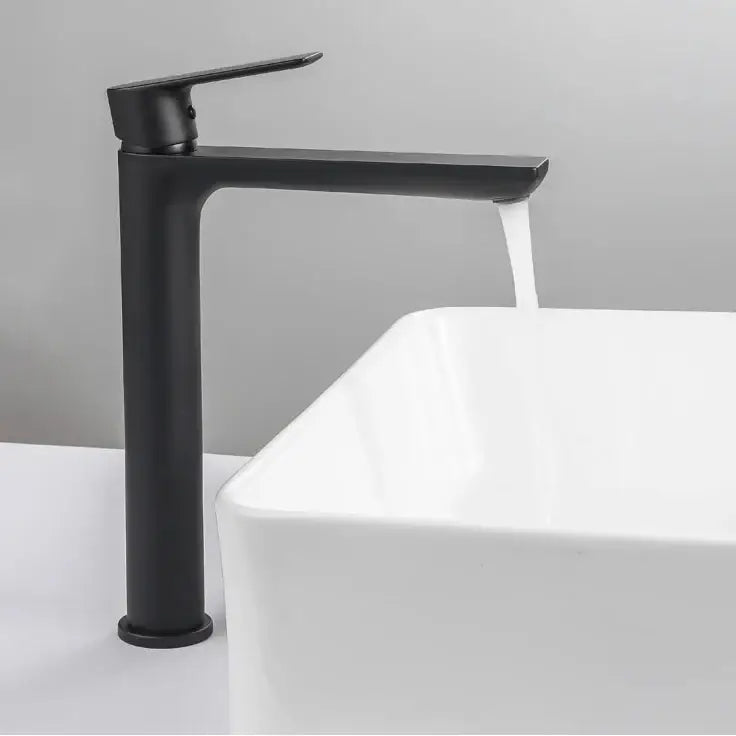 Modern matte black basin faucet with ceramic valve core and short tap styles features a sleek minimalist design