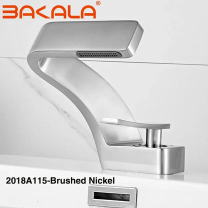 Modern matte black basin faucet with brushed nickel finish, sleek curved design, and integrated spray head for bathroom use