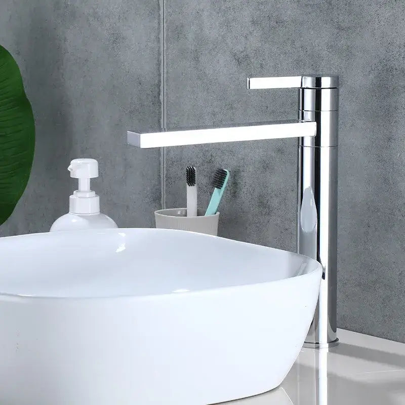 Modern chrome-finished basin faucet with sleek rectangular spout and tall cylindrical base for decorbites gold solid brass use