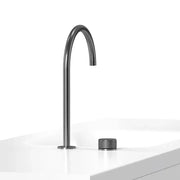 Modern matte black basin faucet with a sleek curved spout and textured cylindrical base for bathroom sinks by decorbites