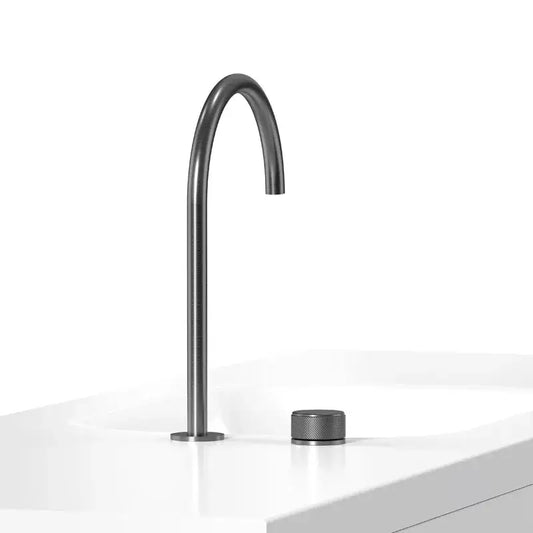 Modern matte black basin faucet with a sleek curved spout and textured cylindrical base for bathroom sinks by decorbites