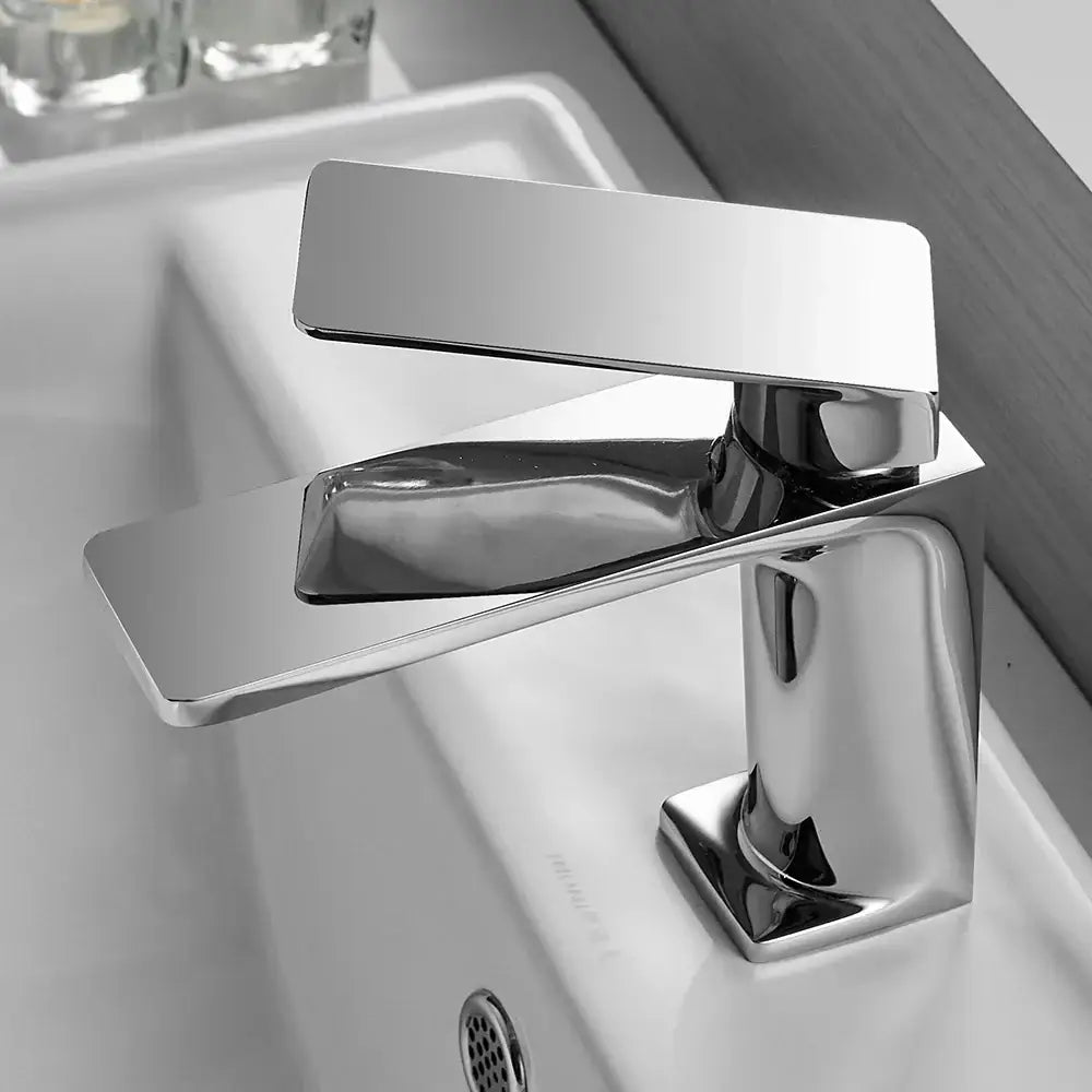Modern chrome-finished basin faucet mixer tap with a sleek rectangular spout and handle for bathroom use