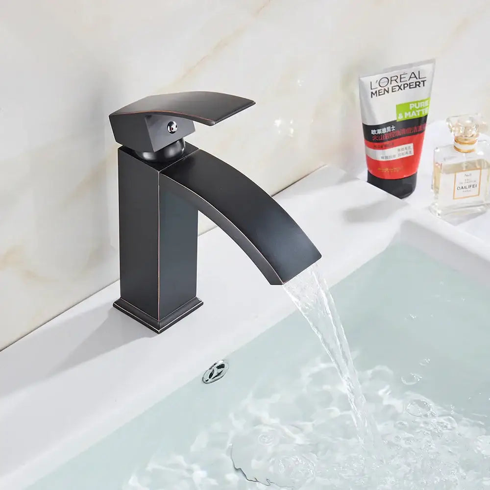 Modern matte black basin mixer faucet with a sleek angular design and curved spout for bathroom use