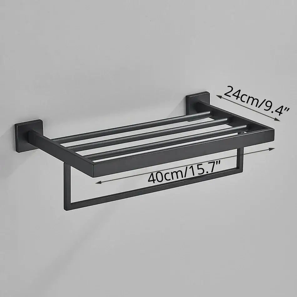 Modern matte black bathroom accessories set featuring a black matte-finished metal towel rack with four bars and lower loop decorbites black bathroom