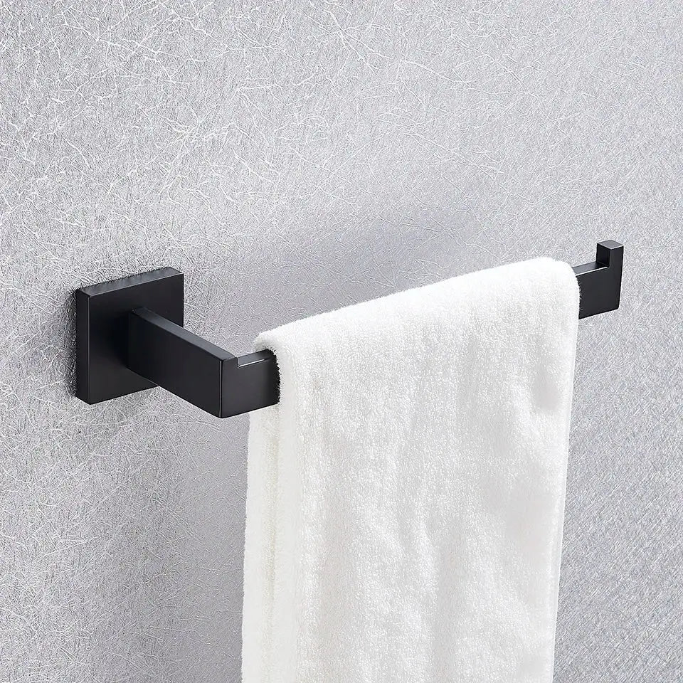 Black matte finished metal bathroom towel rack with white terry cloth towel in decorbites black bathroom accessories set