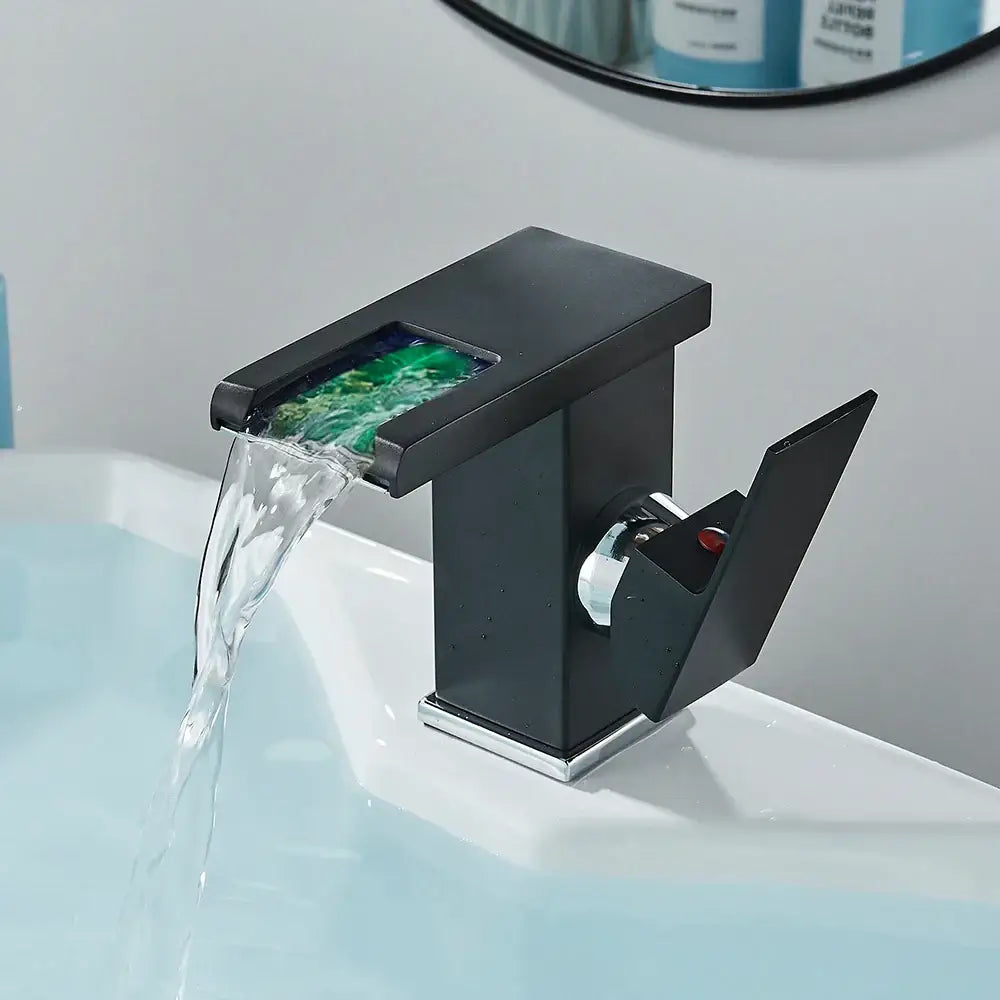 Modern matte black bathroom faucet set with green translucent mosaic insert and chrome accents for sleek bathroom use