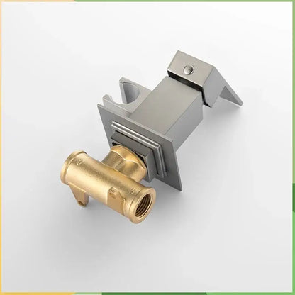 Modern brushed stainless steel and brass bidet faucet shower mixer with sleek angular design for bathroom use