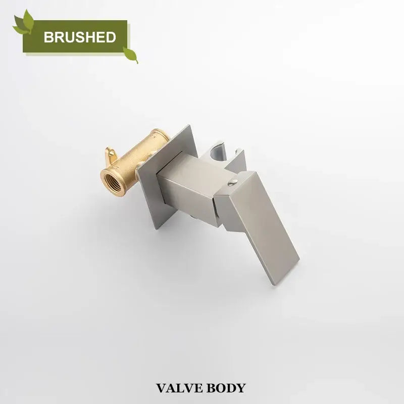 Brushed stainless steel and brass valve body of a modern matte black bidet faucet shower mixer with angular design