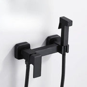 Modern matte black bidet spray gun set featuring a black matte-finished bathroom faucet with handheld showerhead and flexible hoses