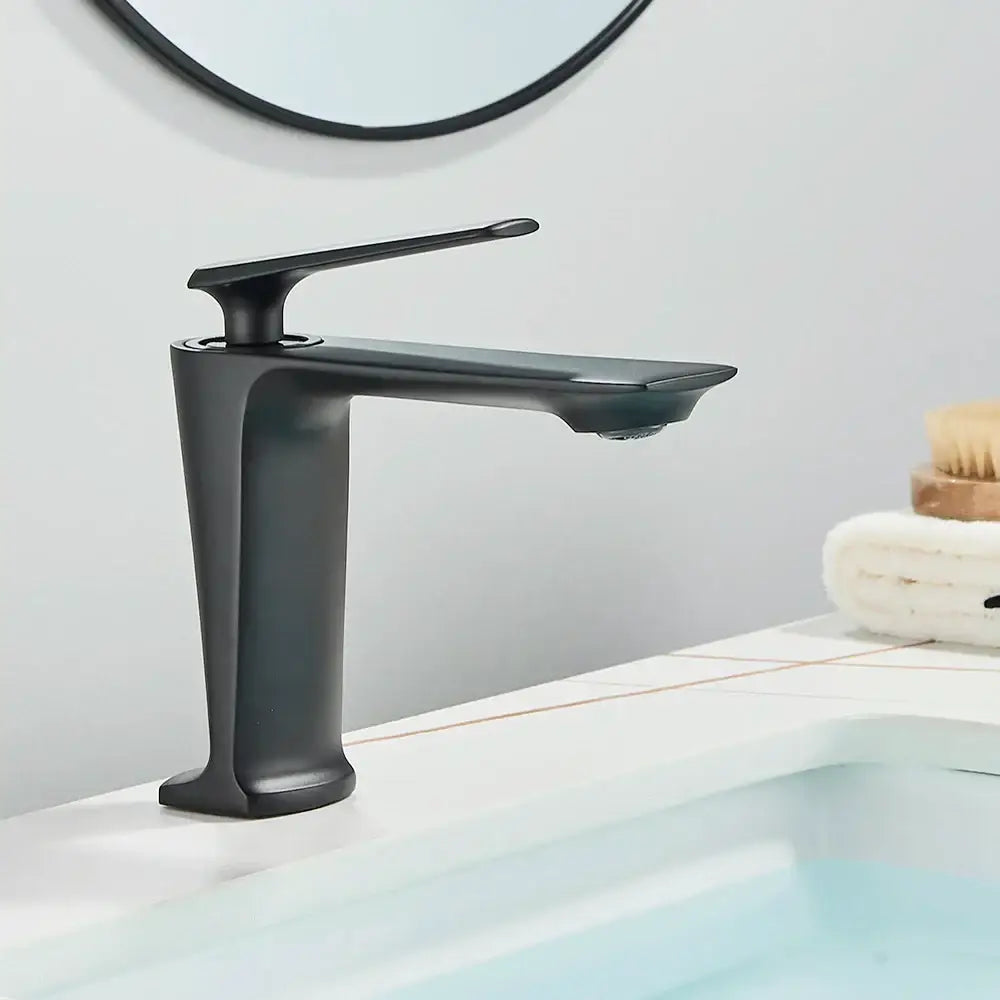 Modern matte black brass bathroom sink faucet with sleek minimalist design and flat spout for black brass bathroom decorbites