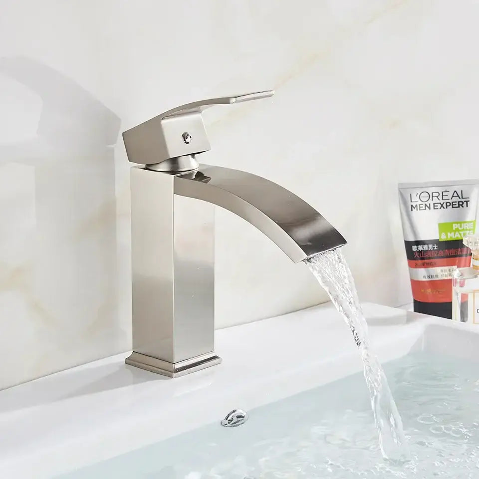 Modern matte black brass bathroom waterfall sink faucet with sleek arched spout and decorbites black brass finish