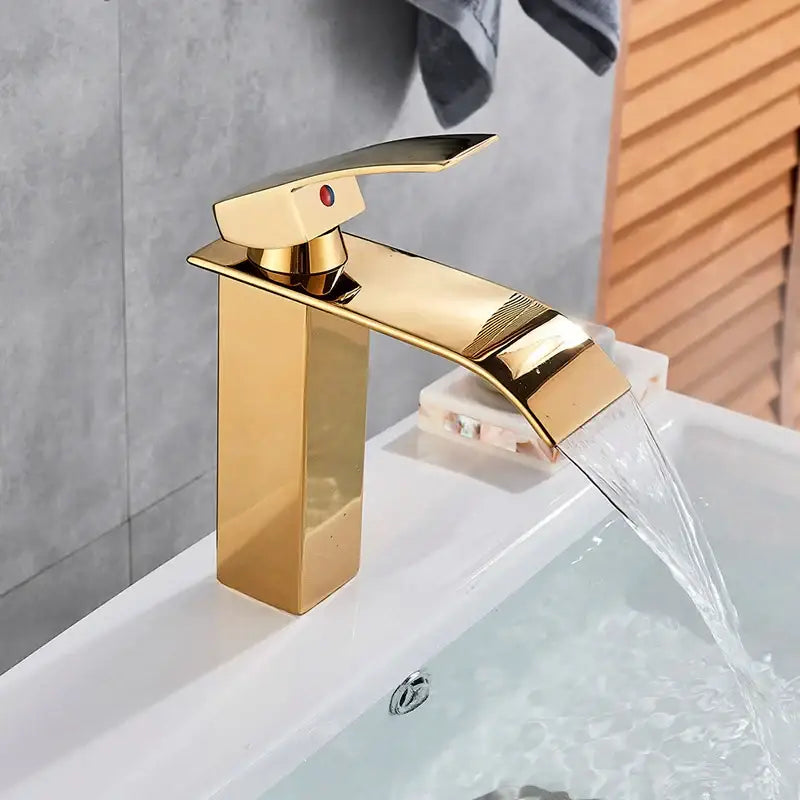 Modern matte black brass bathroom waterfall sink faucet with gold-colored rectangular flow spout by decorbites black brass