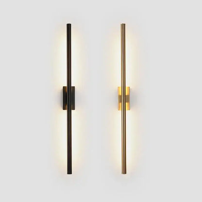 Two modern minimalist wall lights in matte black and decorbites brass gold led with sleek vertical cylindrical design