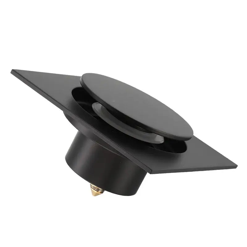 Modern matte black brass shower floor drain with square matte finish and brass shower floor mounting screw by decorbites