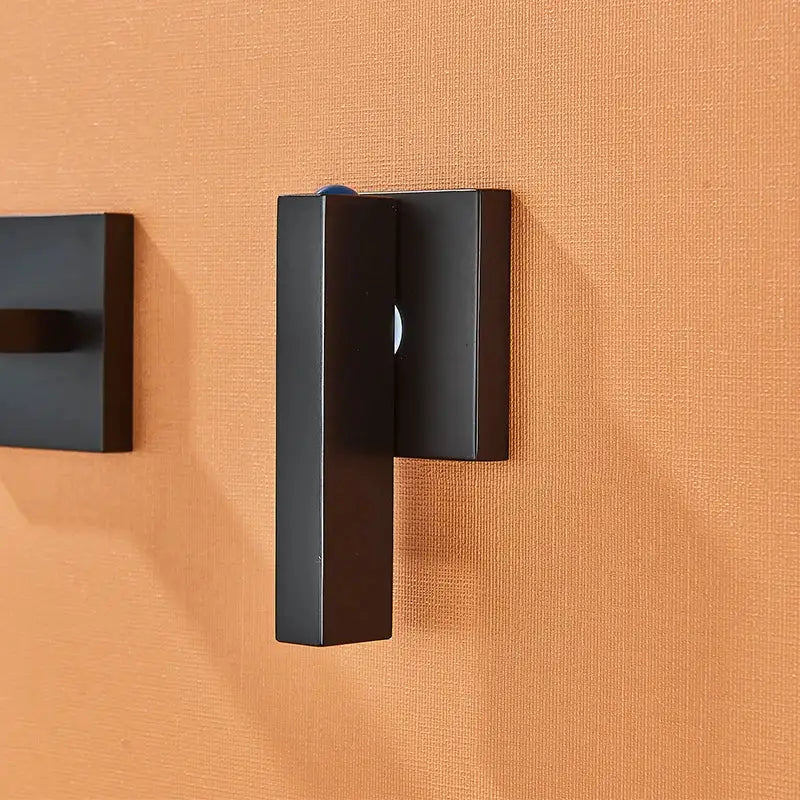 Black matte brass wall-mounted hook with sleek rectangular design for modern basin faucet decorbites black brass fixture