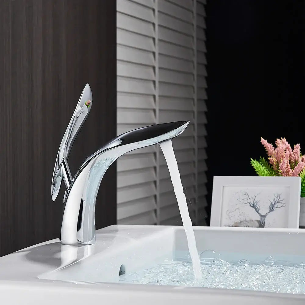 Modern chrome brass washbasin faucet with sleek sculptural design and single spout for decorbites brass washbasin