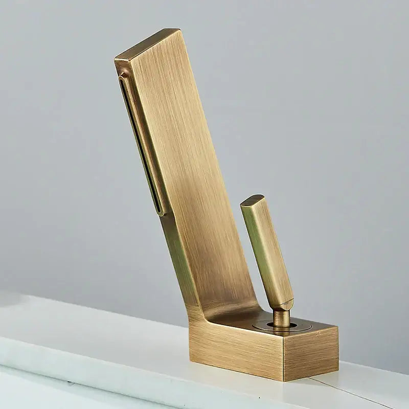 Brass-finished modern wall-mounted hook with sleek brushed metal finish complementing decorbites brass waterfall basin faucet