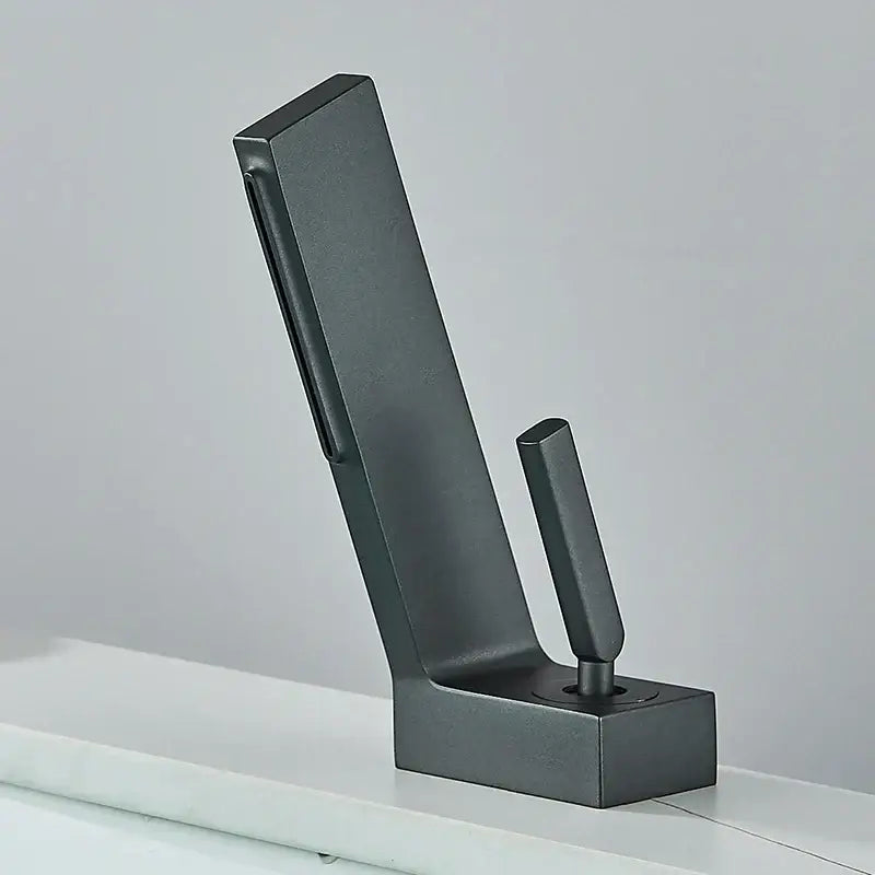 Matte black metal coat hook with sleek modern design and sturdy base complementing decorbites brass waterfall basin faucet