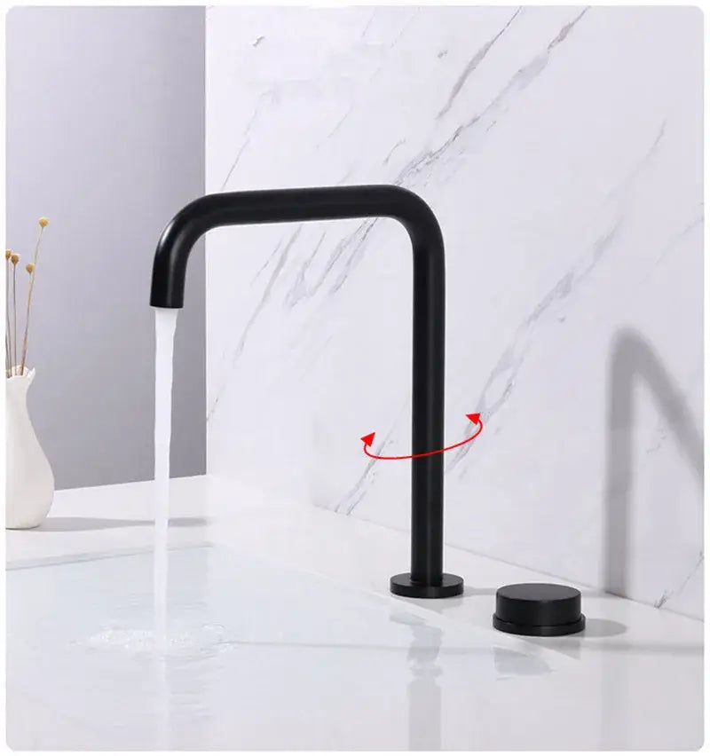 Modern matte black basin faucet with curved spout two cylindrical handles and brushed gold accents decorbites brushed gold