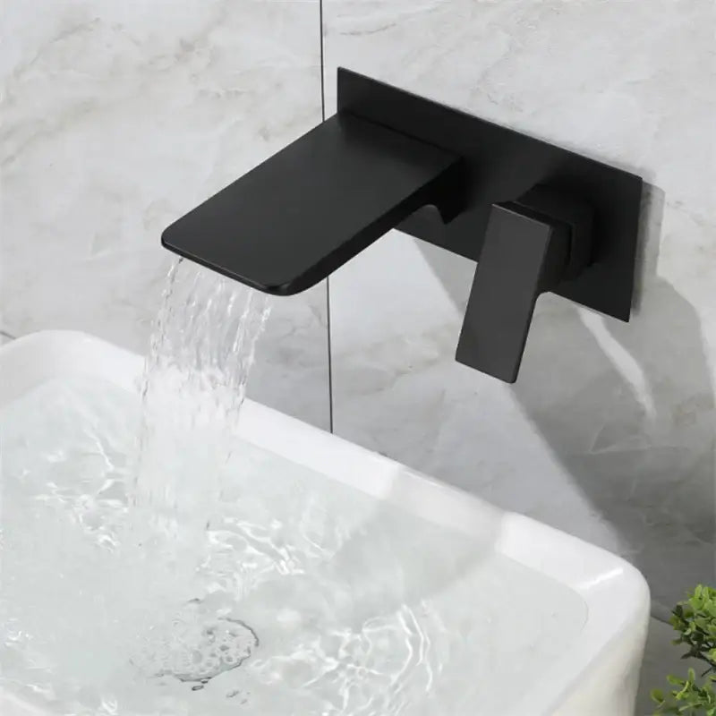 Modern matte black basin faucet with solid brass construction and brushed gold accents for bathroom use