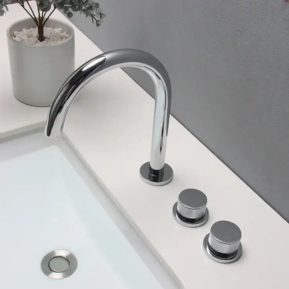Modern chrome-finished basin faucet with sleek curved spout and brushed gold basin faucet handles for bathroom sinks