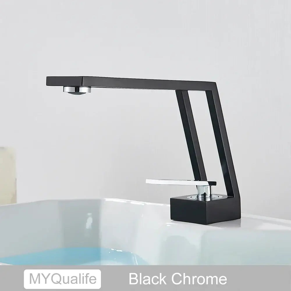 Modern matte black and chrome waterfall basin sink faucet with sleek angular design and silver handle for brass basin sink decorbites