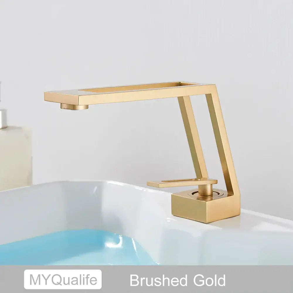 Modern matte black and chrome waterfall basin sink faucet with brushed gold brass basin and sleek angular rectangular spout