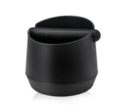 Modern matte black coffee knock box with black matte-finish coffee scoop featuring ergonomic handle and sleek design