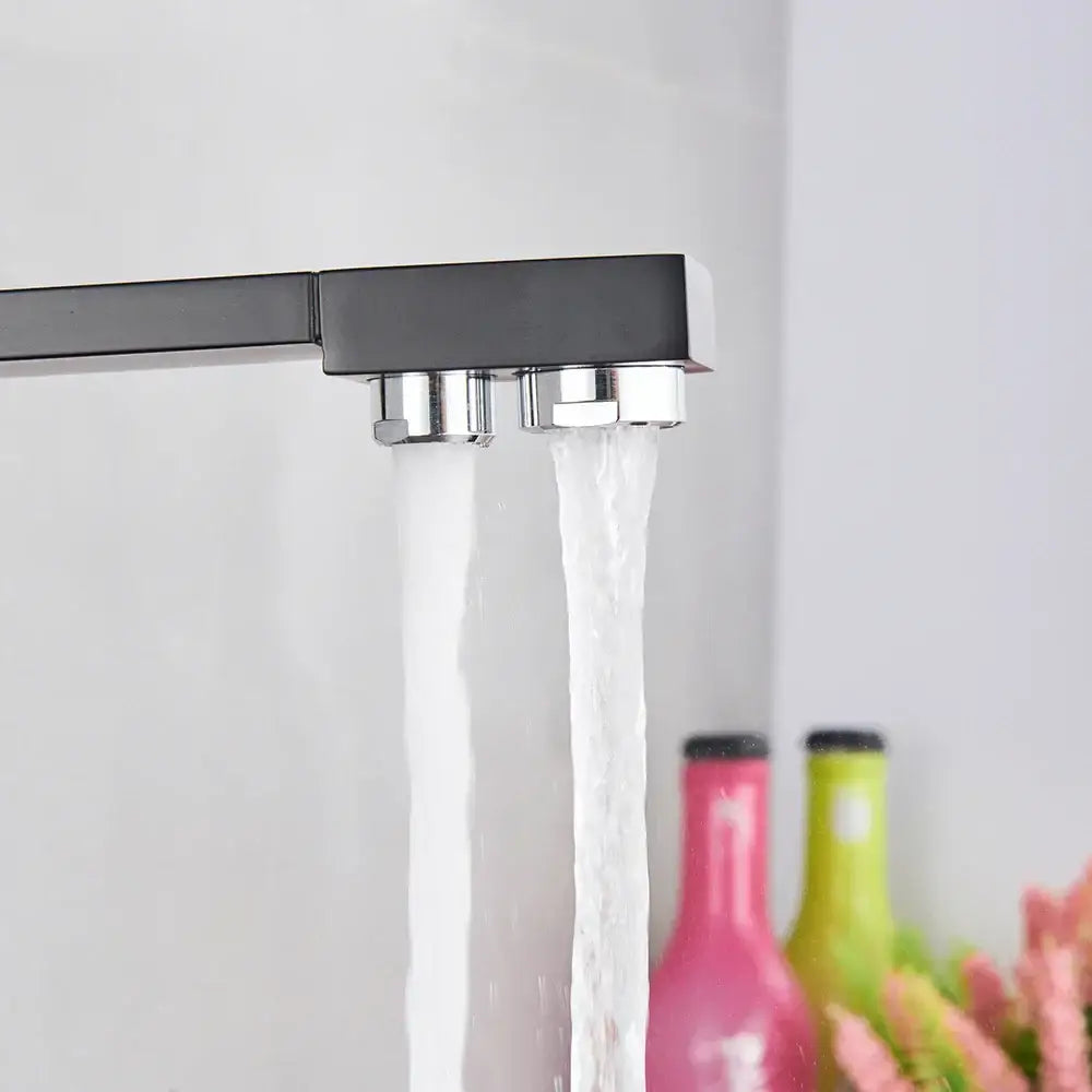Modern matte black curved dual handle kitchen faucet with black matte finish and chrome accents for beige purity kitchen decorbites