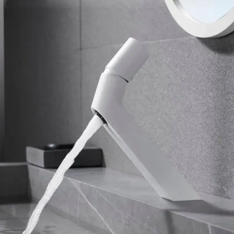 Modern white ceramic decorbites basin faucet with sleek angular design and single spout for bathroom sink use