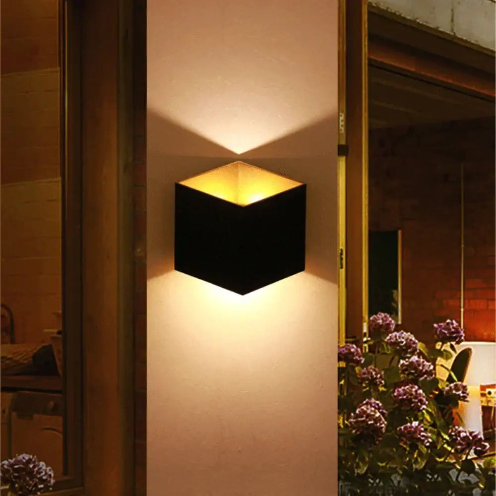 Modern matte black dual-head wall light with black geometric design and warm golden light for outdoor decorbites wall lamp decor